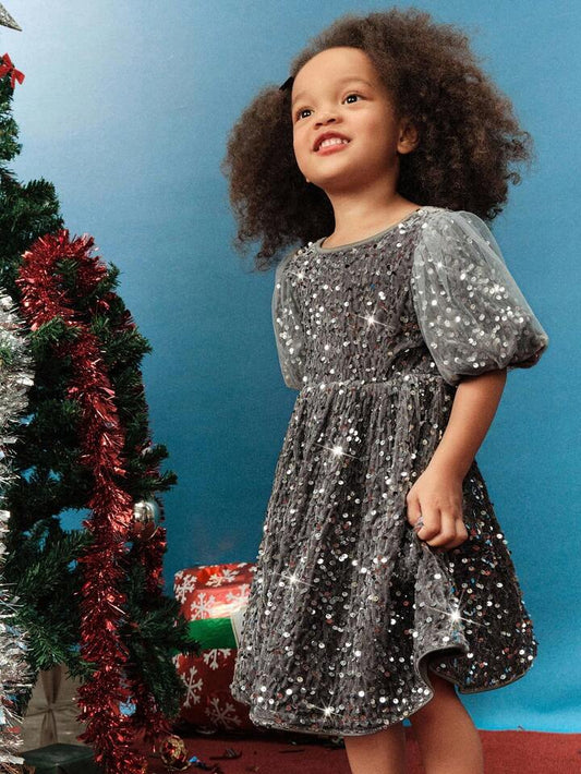 Robe de fête scintillante à sequins et manches bouffantes en tulle étoilé