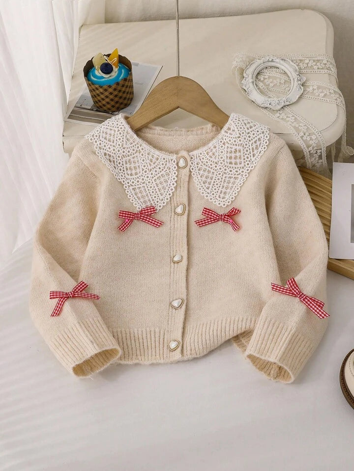 cardigan maille nude à grand col dentelle guipure et nœuds vichy rouge